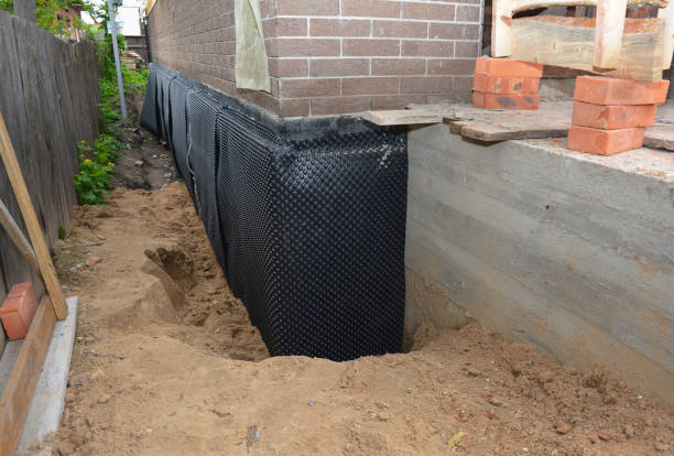 Happy homeowners after waterproofing job in Jamison
